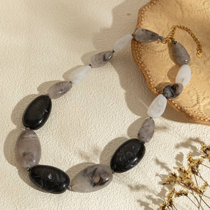 COSMOS - Wholesale Beaded/Pearl Necklace - This long necklace is made of oval resin beads, with1