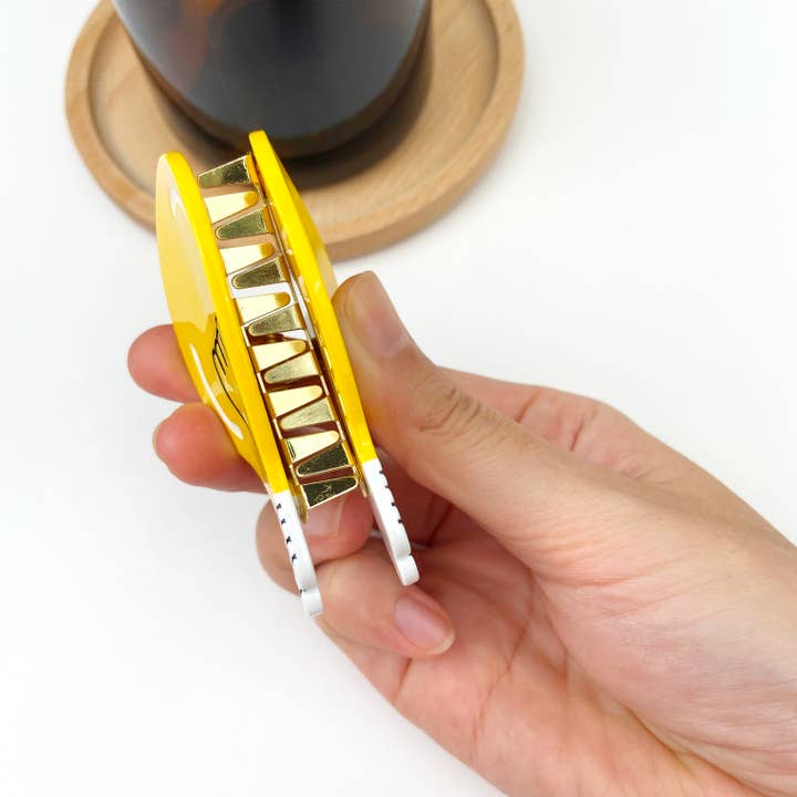 yellow Creative cute light bulb alloy hair clip for wholesale on Faire