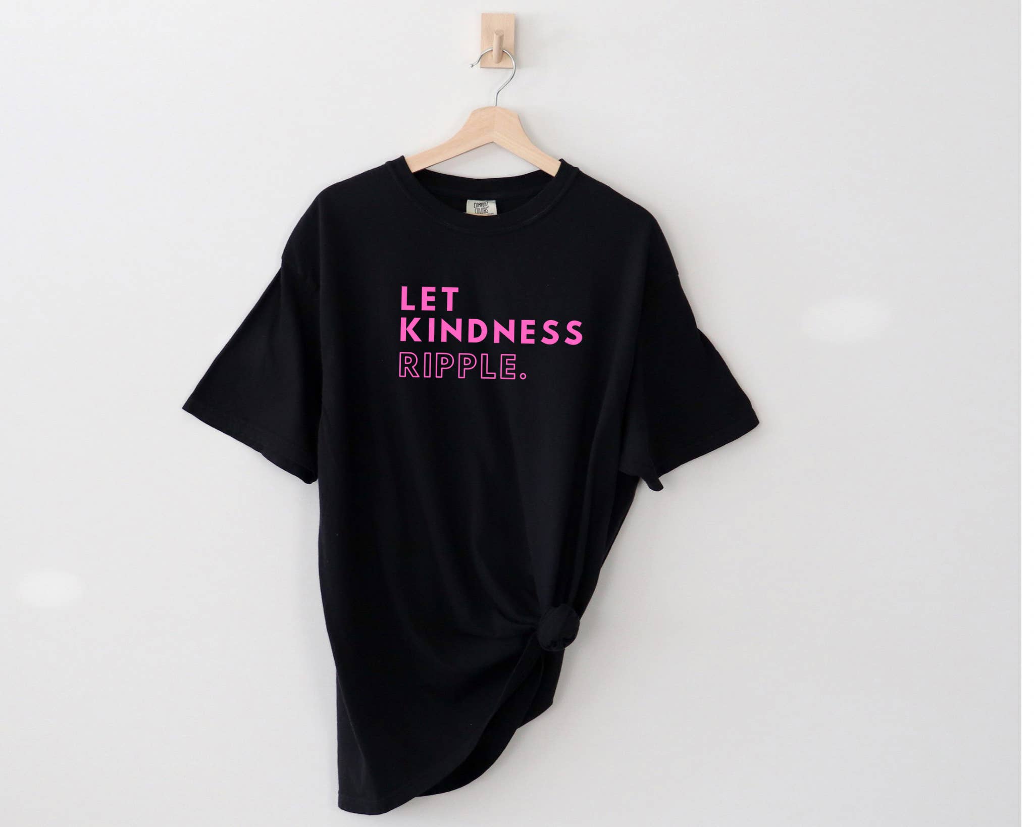 Black Shirt Pink Letters ADULT COMFORT COLORS - Let Kindness Ripple for wholesale on Faire