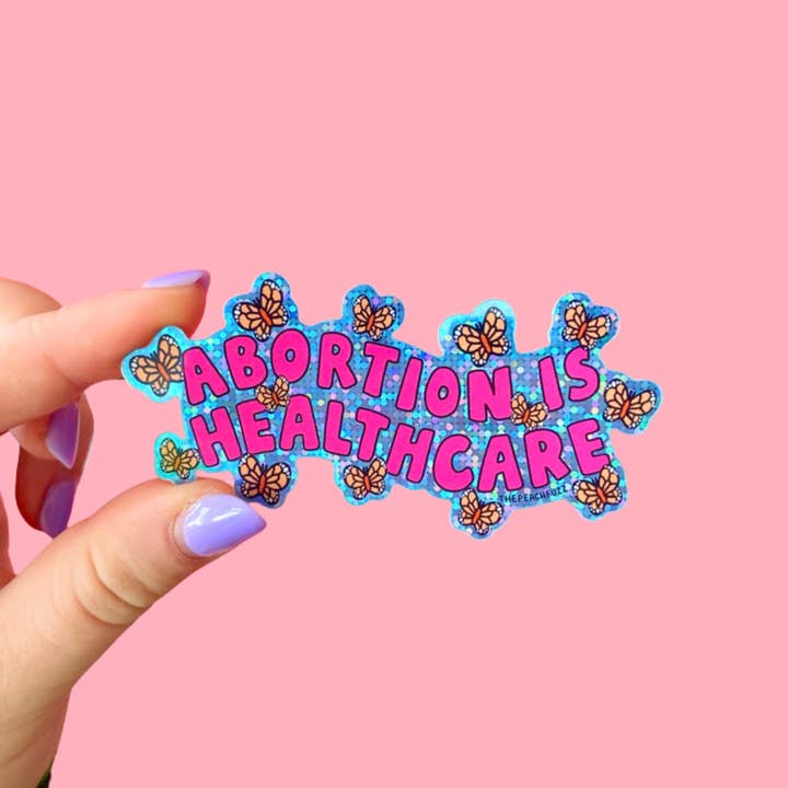 The Peach Fuzz - Wholesale Sticker - Abortion Is Healthcare Glitter Sticker1