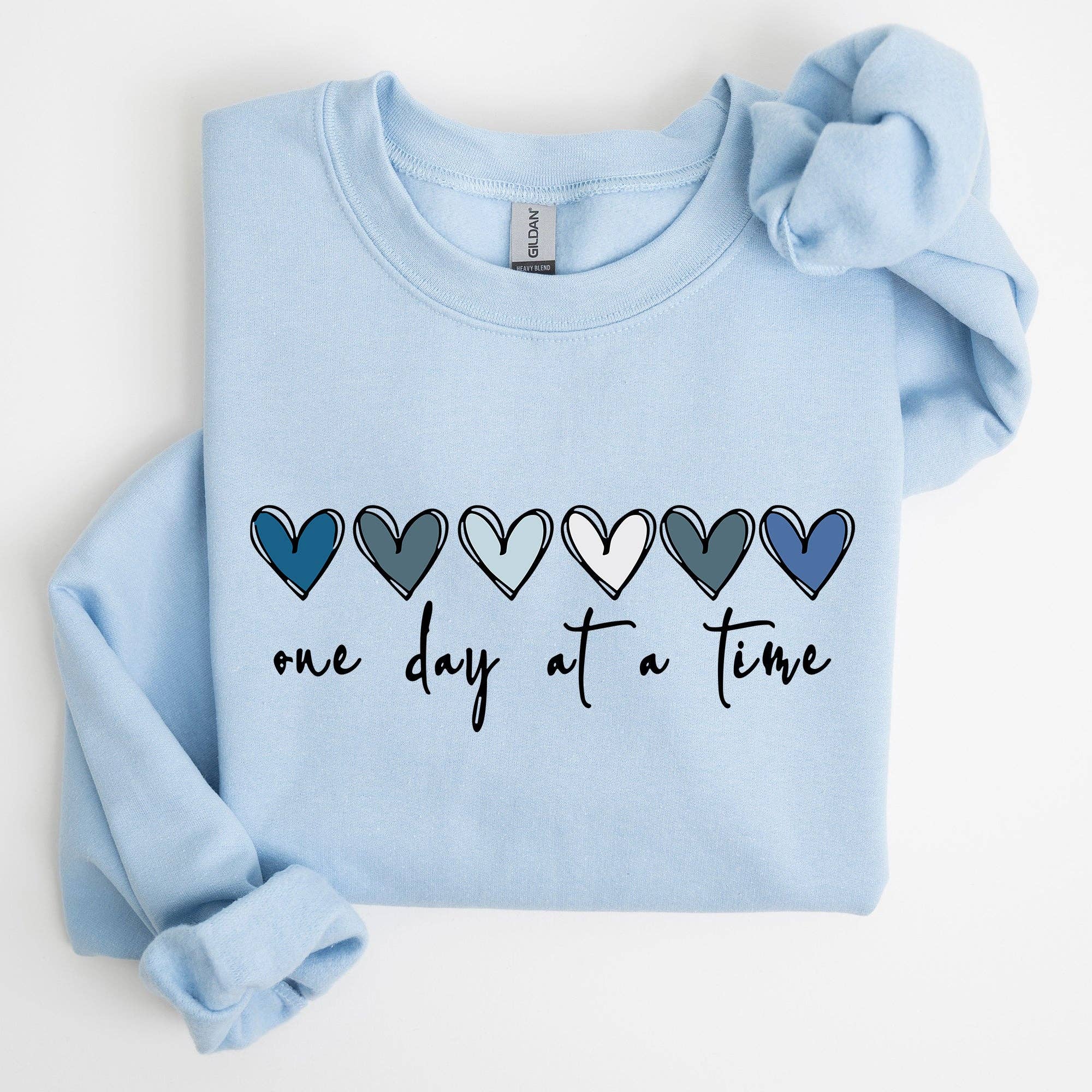 Refinery Number One LLC – wholesale Graphic sweatshirt – Women’s – One Day At A Time, Mental Health,Wellness, Hearts Sweatshirt1