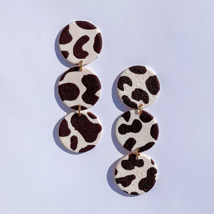 dark brown cow print dangles for wholesale by The Color Theory