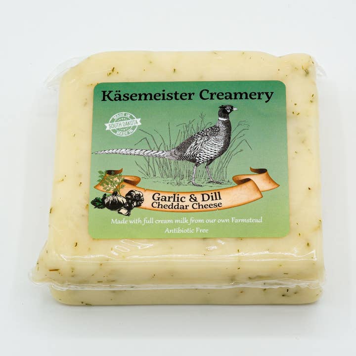 Fromage cheddar à l'ail et à l'aneth pour la vente par Kasemeister Creamery