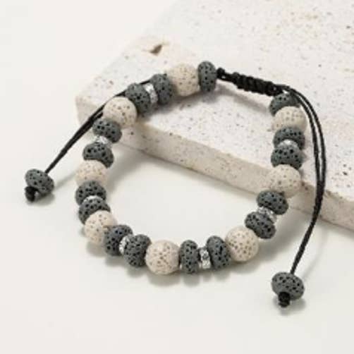 Bracelets in round and flat natural lava stone beads dyed black and white for wholesale by INNOBIZ
