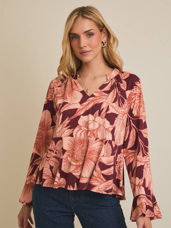 Haut à manches longues avec encolure en V et ourlet évasé à motif floral pour la vente par GILLI