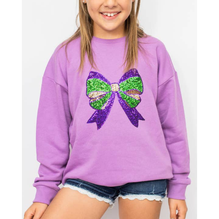 Jeugd Mardi Bow Pailletten Sweatshirt Lichtpaars/Groen -Assorti. voor wholesale door The Royal Standard