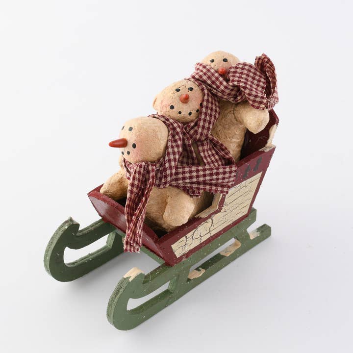 Paper Mache 3 Snowmen on Sleigh 5 inch Tall x 5 inch tall for wholesale by Birch Maison