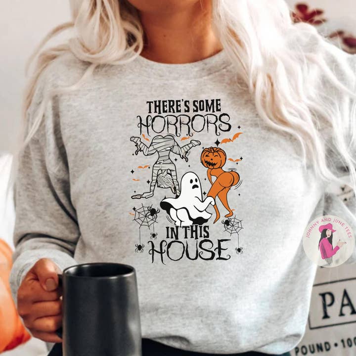 There's Some Horrors In This House Halloween Sweatshirt, for wholesale by Johnny and June Tees