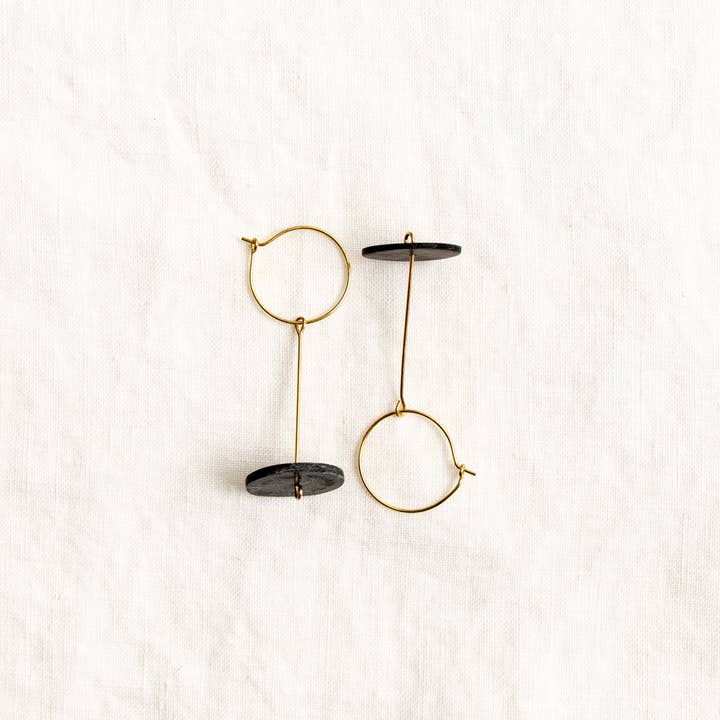 Flying Saucers- black for wholesale by Slow As Folk