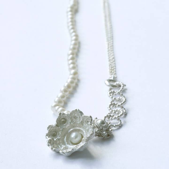 Zeeland button necklace with white pearls and smaller Zeeland button for wholesale by Hester Zagt Sieraden