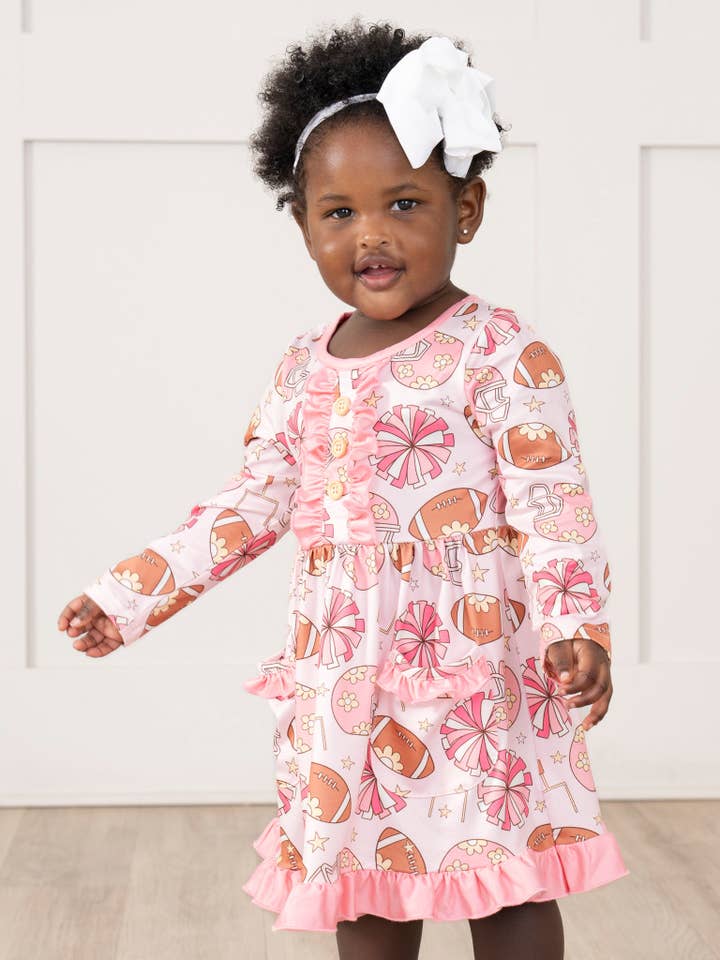 Sassy Snap Ruffle Dress for wholesale by Marie Nicole Clothing