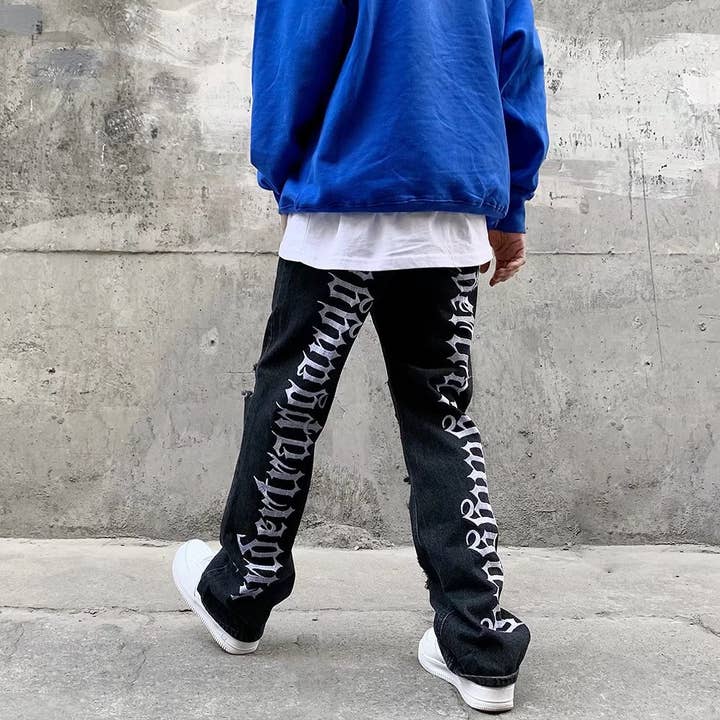 Black Men's hip-hop ripped jeans with letters embroidered for wholesale on Faire