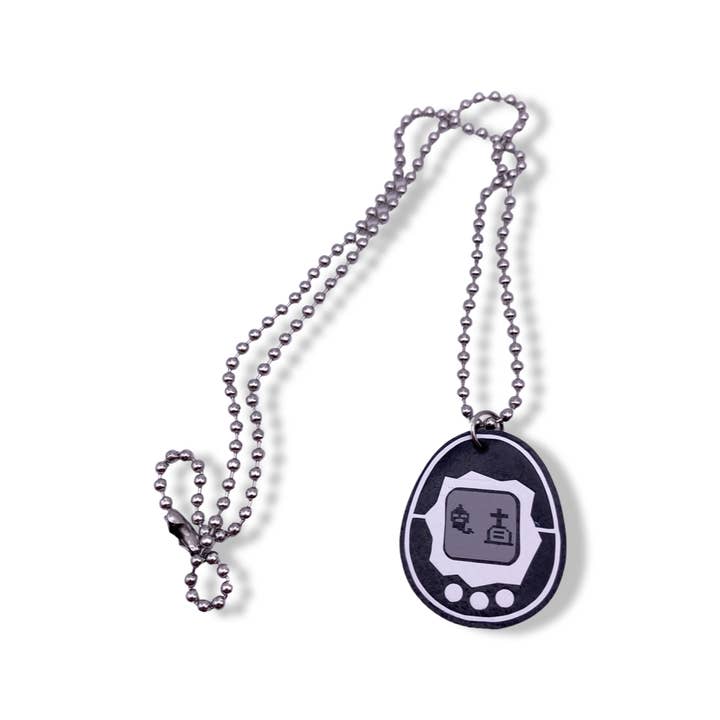 Geekish Gifts – wholesale Pendant/charm necklace – Dead Tamagotchi Necklace