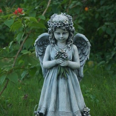 Angel Holding Flowers for wholesale by Hi-Line Gift Ltd.