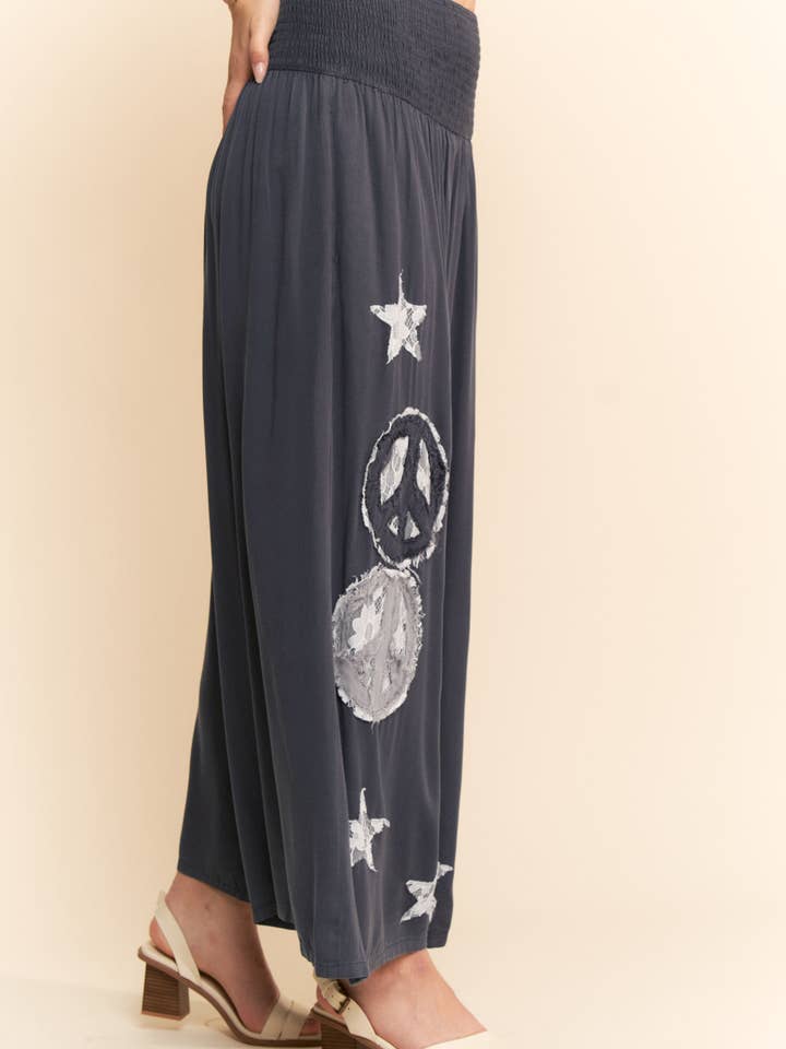 Charcoal PEACE AND STAR PATCHWORK LEG PANTS for wholesale on Faire2