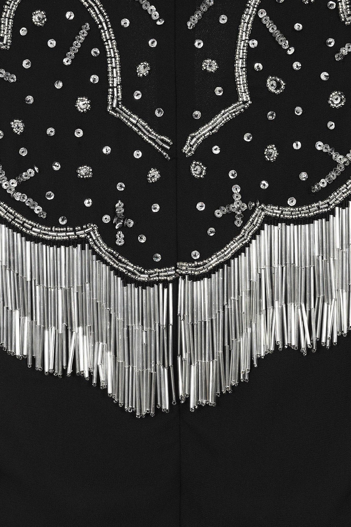 Nero Abito longuette decorato nero Delores con maniche a flauto in vendita all'ingrosso su Faire6