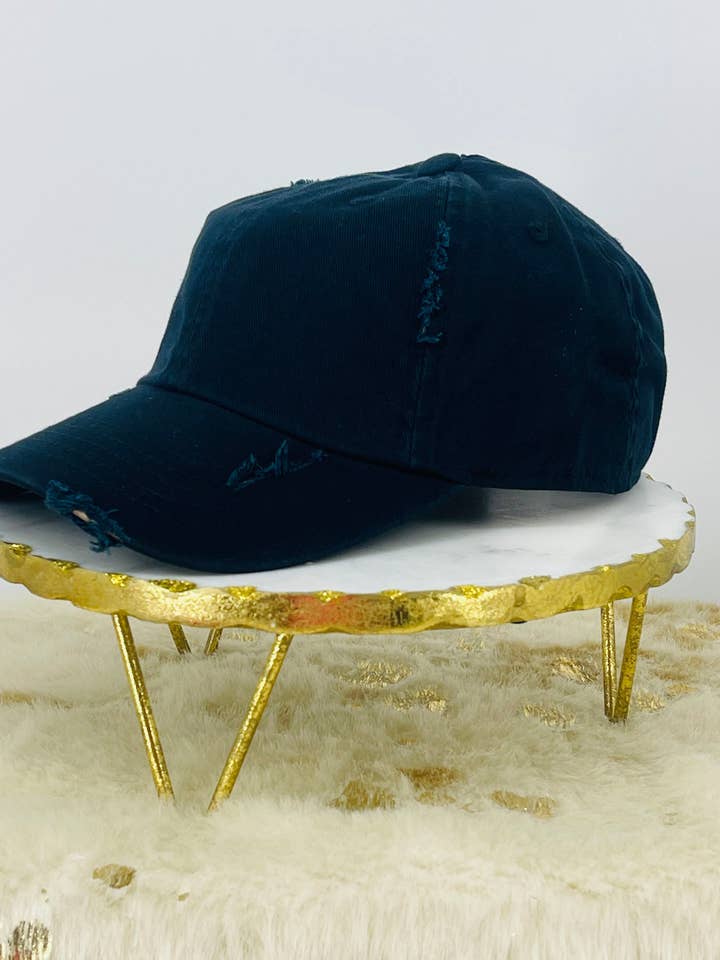 Black Ladies Distressed Ponytail Hat for wholesale by Magnolia & Peach Jewelry Boutique, LLC