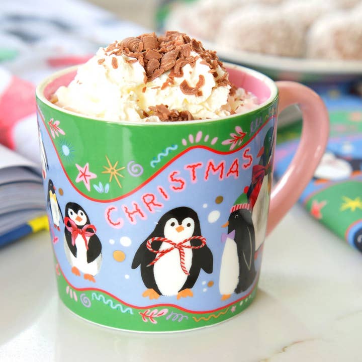 Cosy Penguins Christmas Mug for wholesale by Eleanor Bowmer