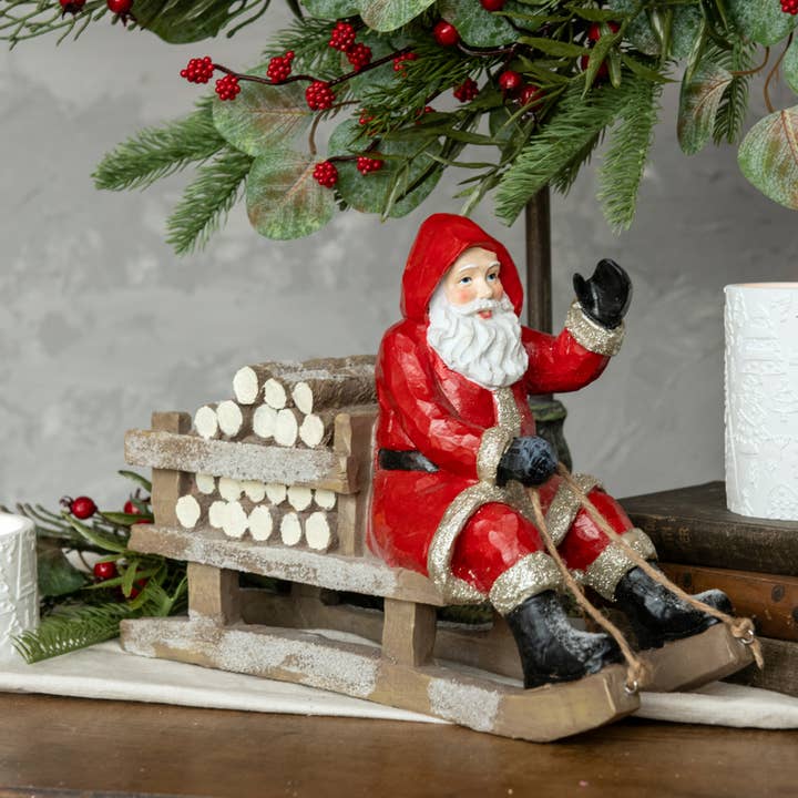 RED SLEDDING SANTA for wholesale by Ragon House