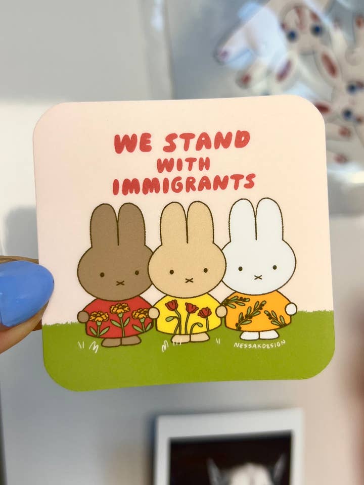 We Stand With Immigrants Vinyl Waterproof Sticker for wholesale by Nessakdesign