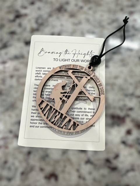 Braving the Heights lineman ornament/story card for wholesale by Ladybug Jane Gifts