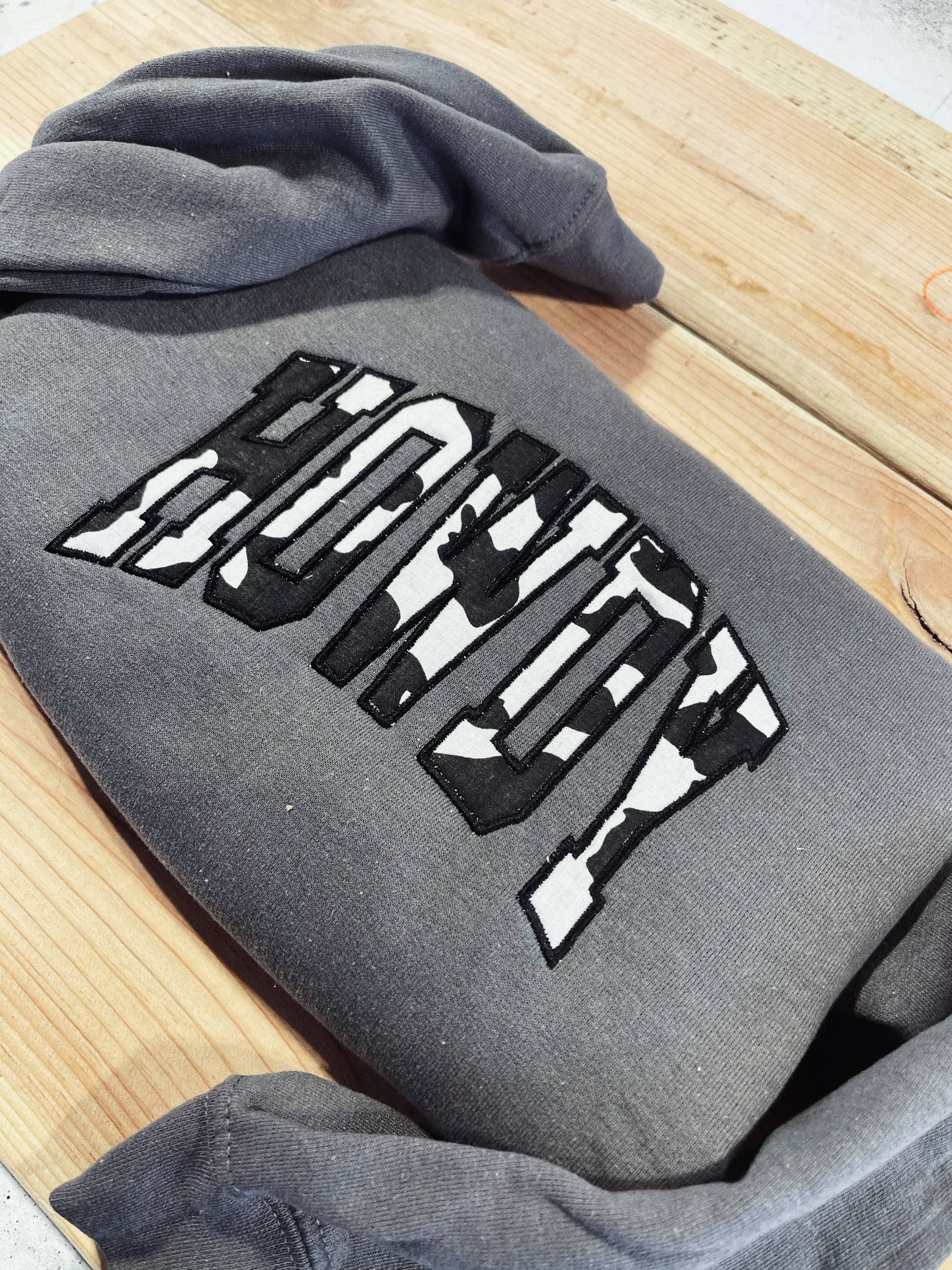 Buckin Barn Wholesale - Wholesale Sweatshirt - Women's - Howdy cowprint  embroidered sweatshirt1