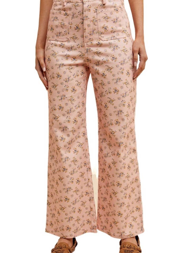 Jeans a gamba larga elasticizzati con tasca frontale stampata a fiori. per la vendita all'ingrosso da parte di Vanilla Monkey