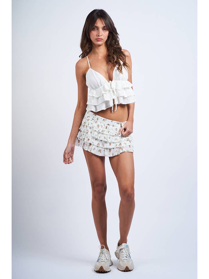 OEILLET BLANC CROP TOP À VOLANTS SANS MANCHES BLANC À OEILLETS EN FORME DE CŒUR en vente sur Faire2