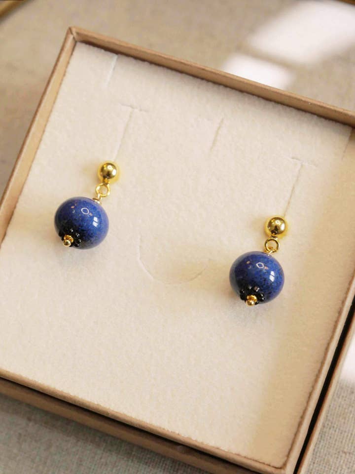 Golden blueberry earrings for wholesale by CHRISTEL BUSSIERE
