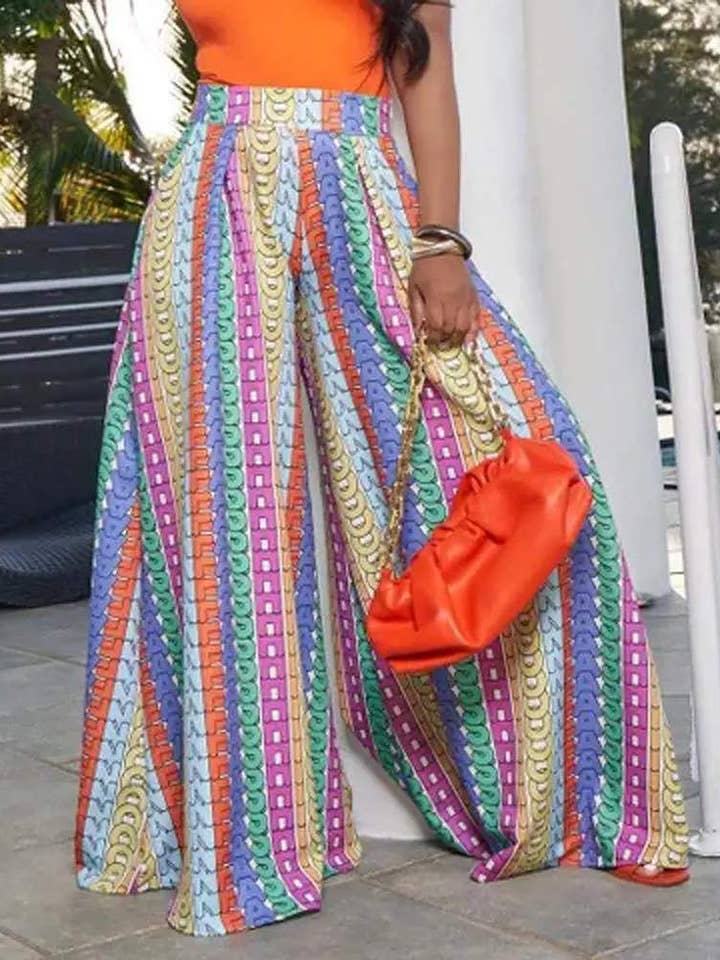 MULTICOLORE pantaloni larghi con dettaglio plissettato stampa lettere allover in vendita all'ingrosso su Faire