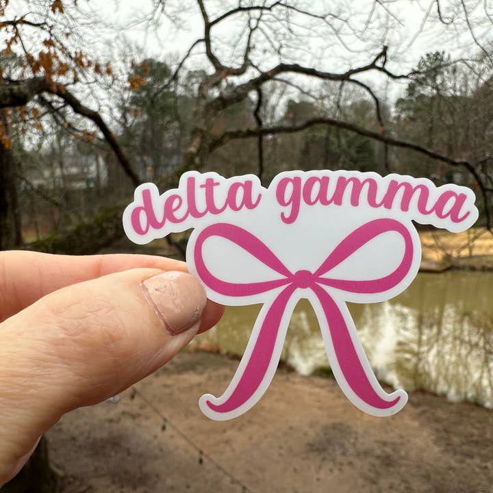 Sticker | DG | Delta Gamma Pink Bow | Waterproof Vinyl Sticker | White | Clear | Permanent | Removable | Window Cling | Glitter | Holographic for wholesale by My Vinyl Cut
