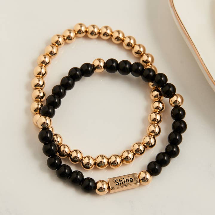 Set di Braccialetti Elasticizzati Hollynd 2 Pezzi con Messaggio Ispiratore per la vendita all'ingrosso da parte di Howard's