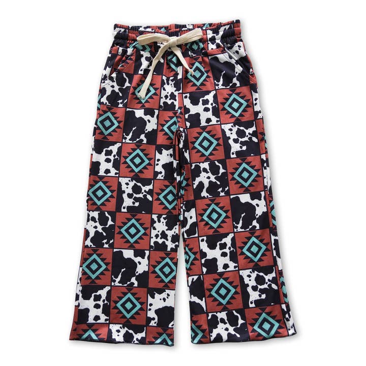 Cow print aztec patchwork western kids girls pants for wholesale by Yawoo Garments