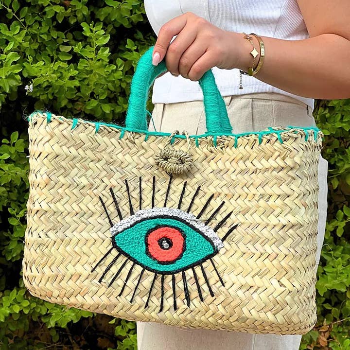 Borsa in paglia intrecciata marocchina fatta a mano con design Evil Eye per la vendita all'ingrosso da parte di Moroccan Natural bazaar