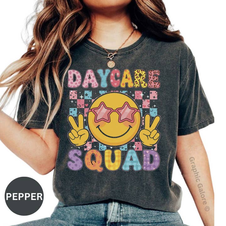 Daycare Squad T-Shirt, Teacher Appreciation, Funny Smiley Face Shirt, Preschool Team Shirt, Daycare Provider Gift, Happy Face T-Shirt for wholesale by Graphic Galore