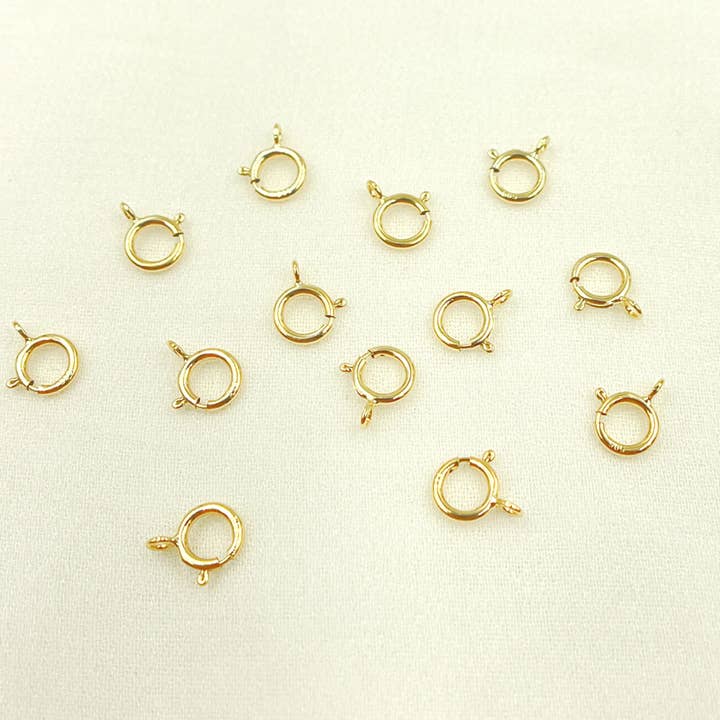 SRC2-14K.14K Solid Gold Spring Ring 6mm. for wholesale by Jewels & Chains