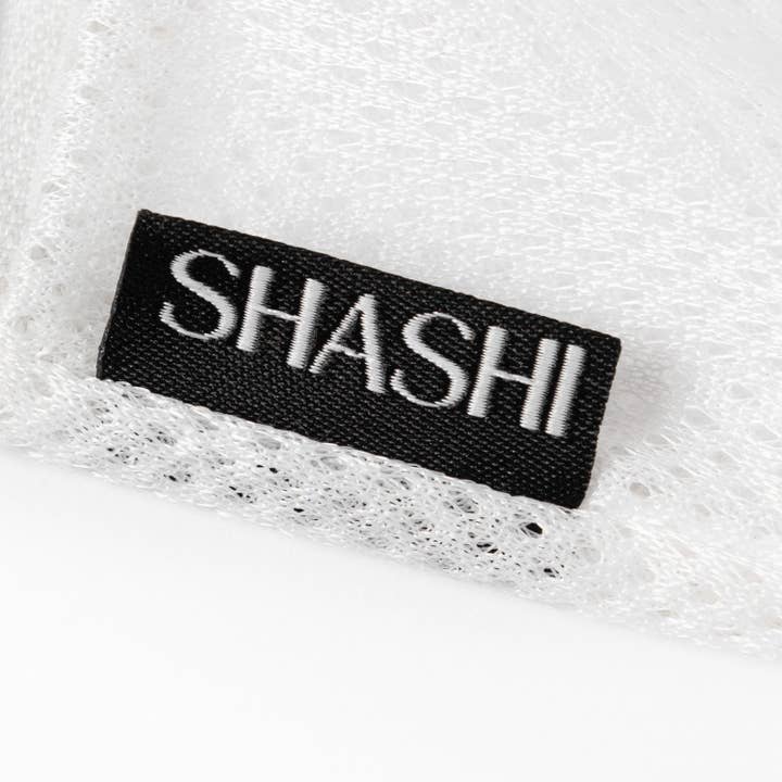White SHASHI Laundry Bag for wholesale on Faire