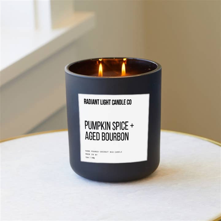 Pumpkin Spice + Aged Bourbon Scented 12oz Black Glass Candle for wholesale by Radiant Light Inc