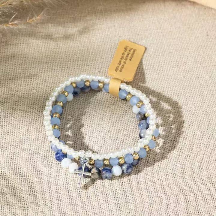 Cute Blue and White Cross Stackable Bracelet Christian for wholesale by Purple Myrtle