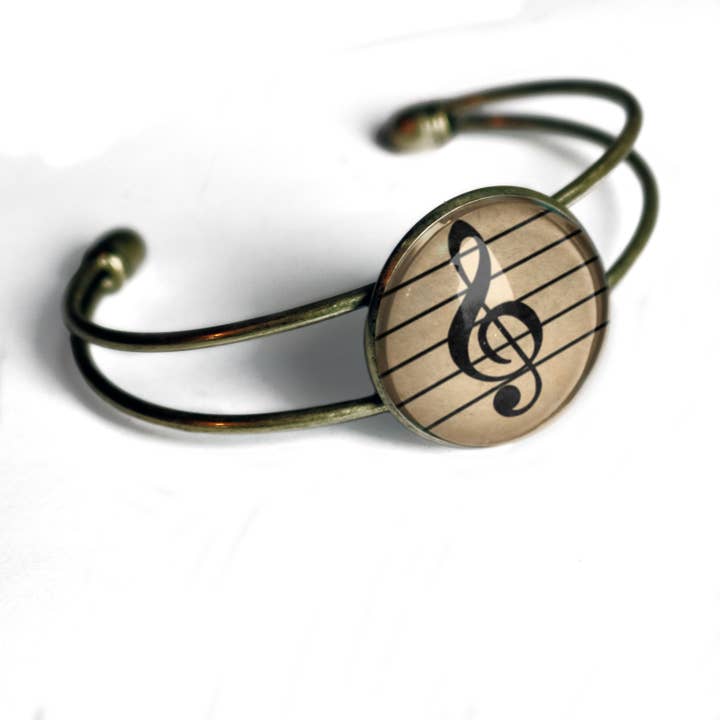 Manchette Treble Clef pour la vente par The Divine Iguana