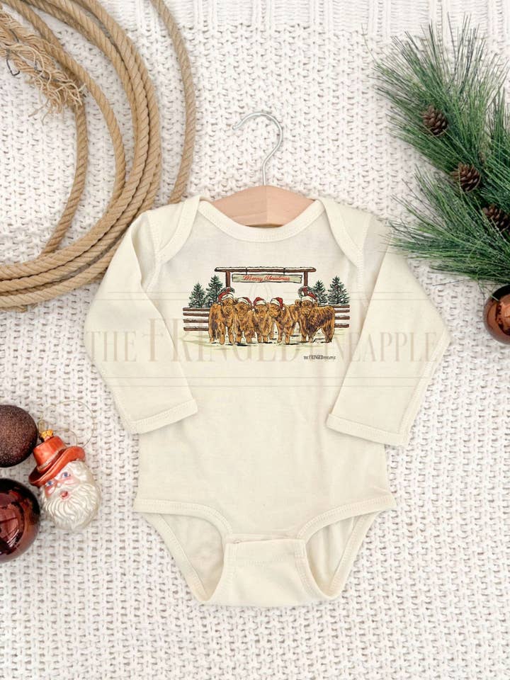 Cream "Merry Christmas Highlands" Onesie for wholesale by The Fringed Pineapple
