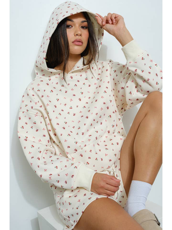 Ivory CHERRY BOW PRINT SWEATSHIRT for wholesale on Faire