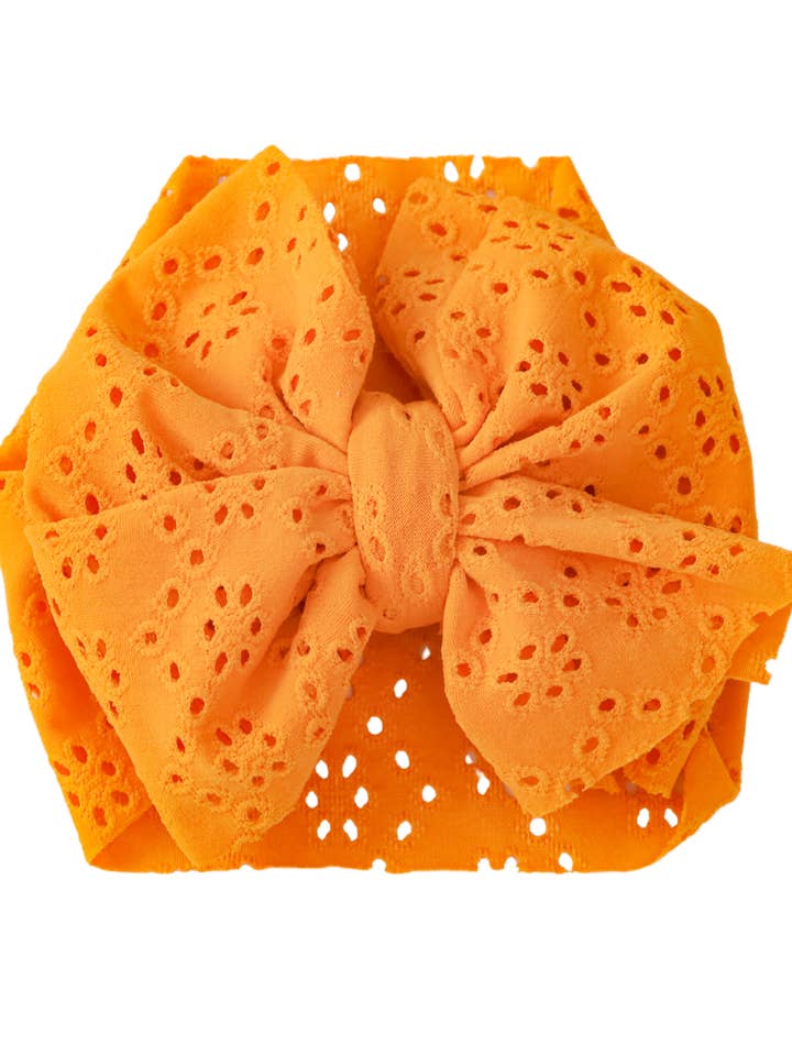 Øjenhulshovedbeklædning med sløjfe - Sennep for engroshandel hos Elle & Mily