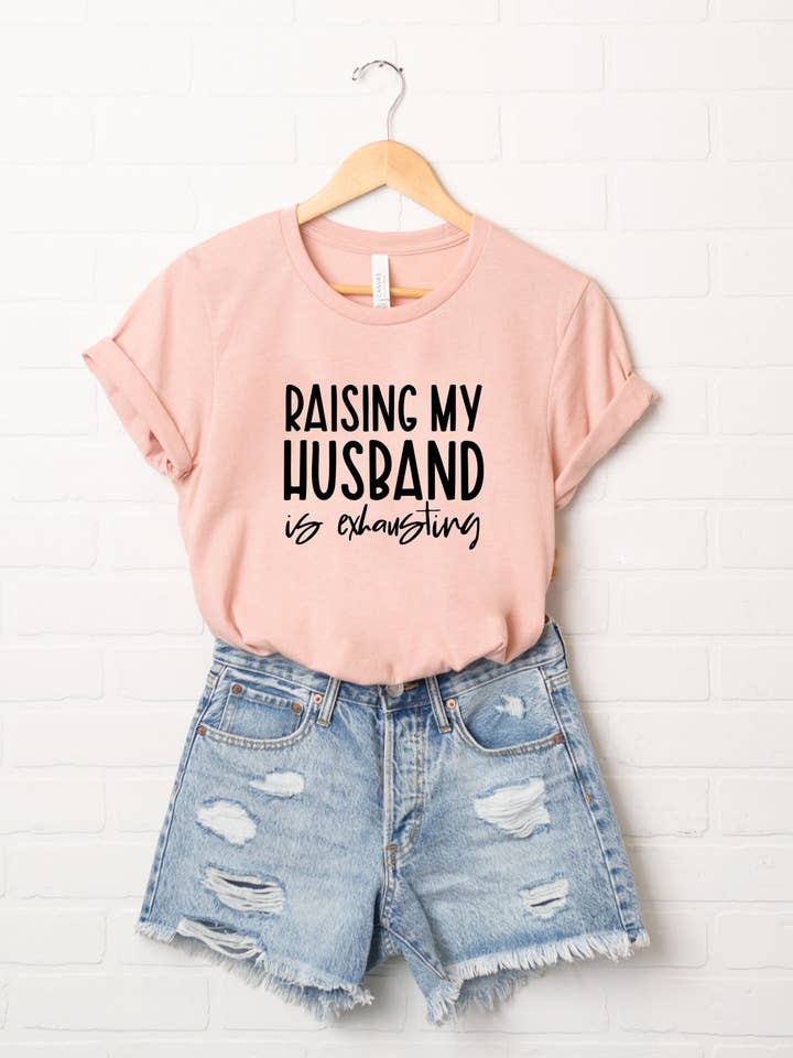 Raising My Husband Is Exhausting | Short Sleeve Crew Neck and other Purchase Wholesale raising my husband is exhausting. Free Returns & Net 60 Terms on Faire trending on Faire.