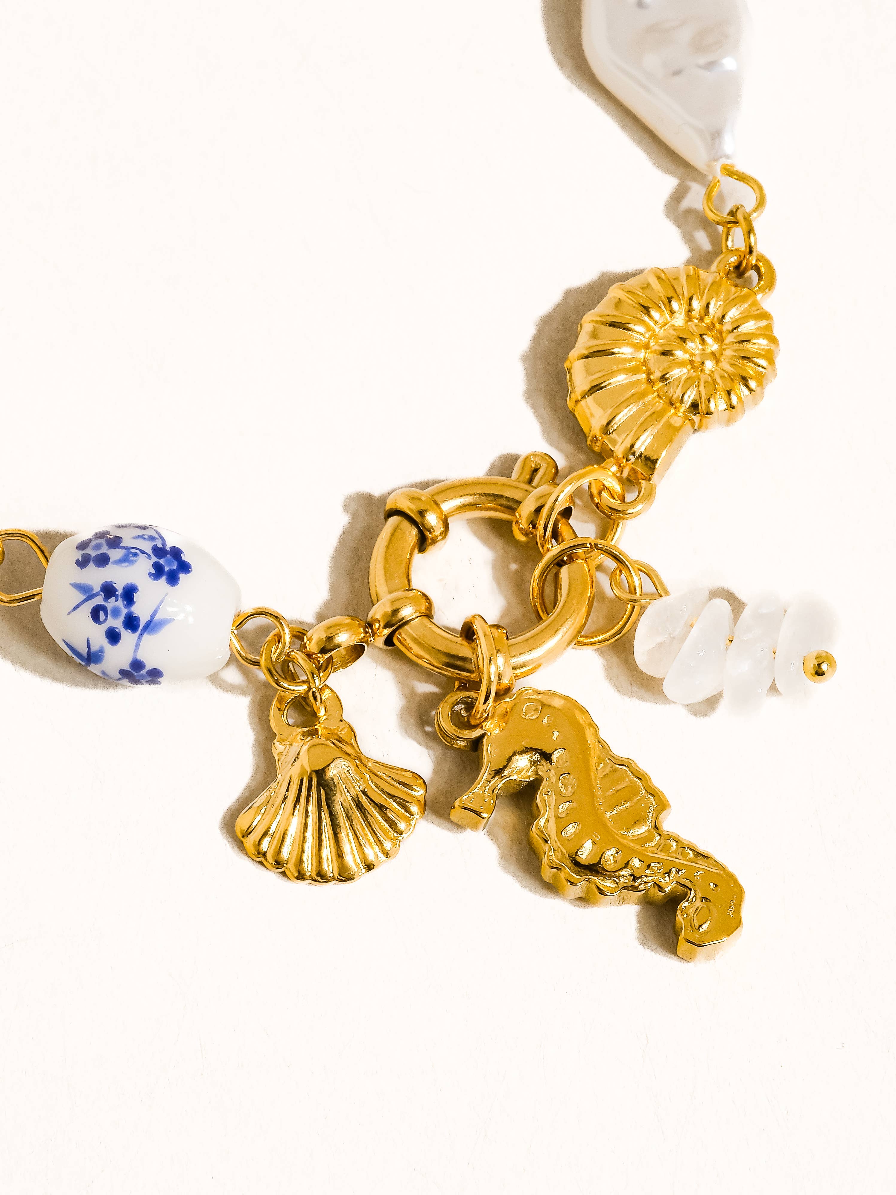 Cecily 18K Gold Non-Tarnish Seahorse Seashell Charm Bracelet for wholesale on Faire2