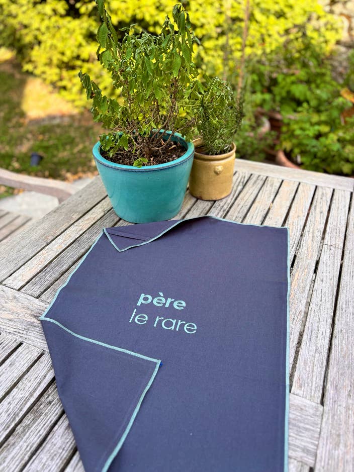 THE EMBROIDERED SLATE TEA TOWEL VITAMIN "PERE LE RARE Blue" for wholesale by LES CHAHUTEES