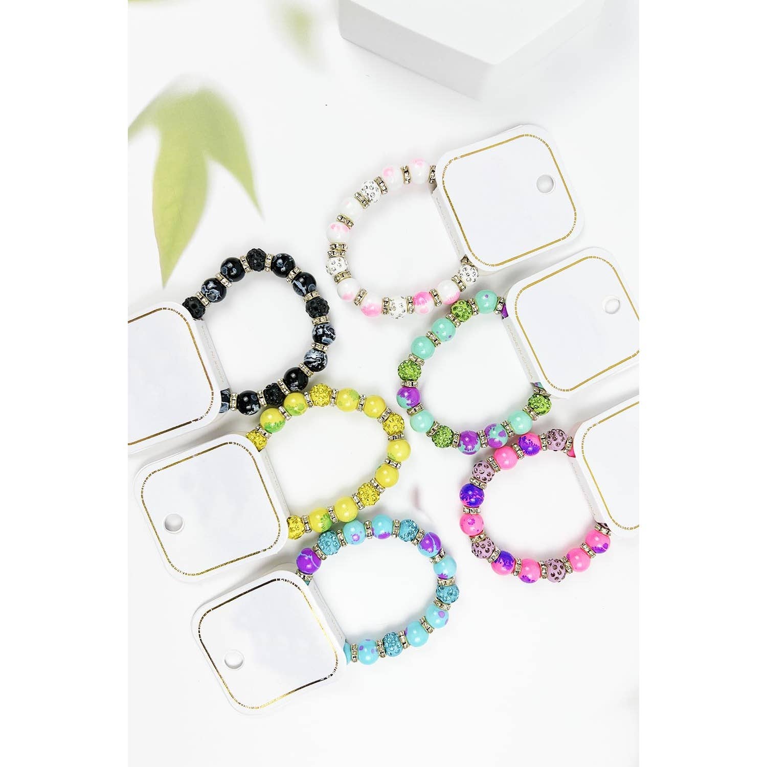 ASSORTED COLORFUL SPECKLED BEADED STRETCH BRACELET for wholesale on Faire2