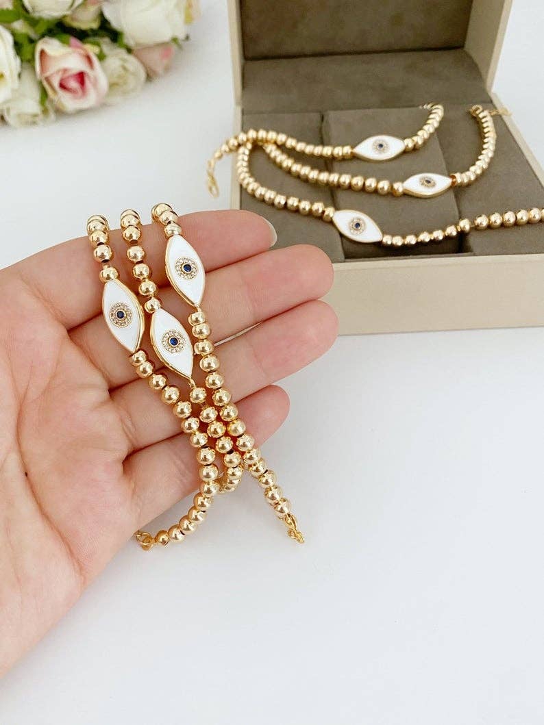Evileyefavor – Großhandel Perlenarmband – Weißes Evil Eye-Armband, wasserdichtes Armband, goldfarbener Perlenstab1