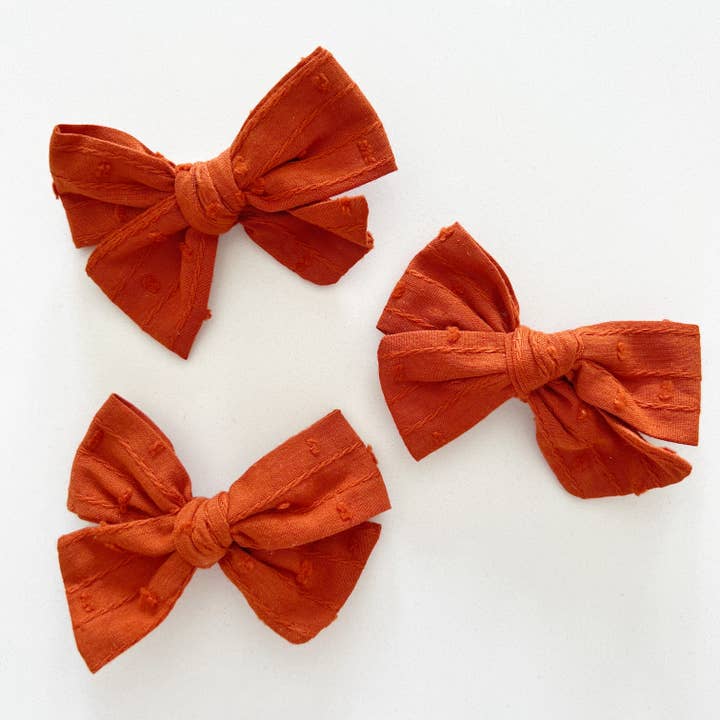 Spice Swiss Dot Bow for wholesale by Bohemian Babies