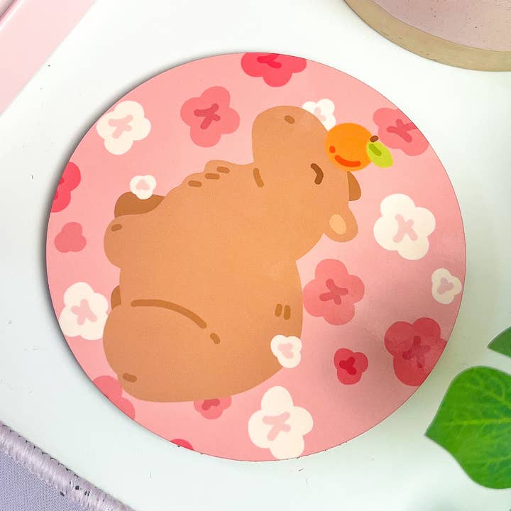Sakura Capybara with Orange Coaster for wholesale by Peaches and Bees.